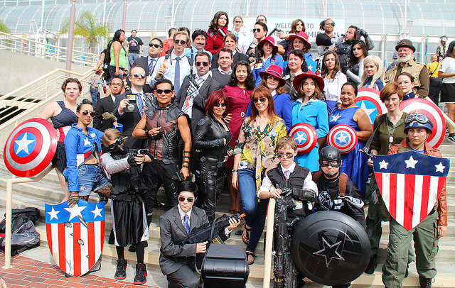 Costume designer Ann Foley poses with Marvel cosplayers